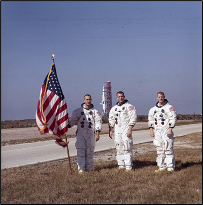 3 astronauts with flag