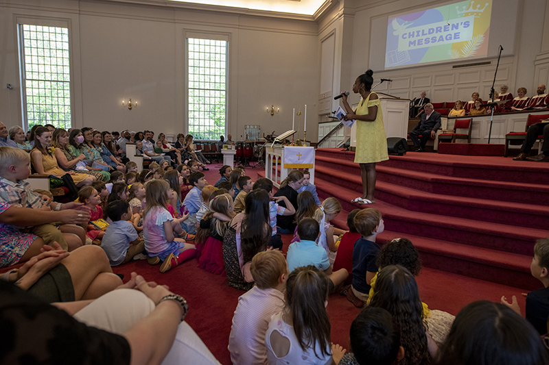Children gather at the front of the church to hear the children's message at HRBC.