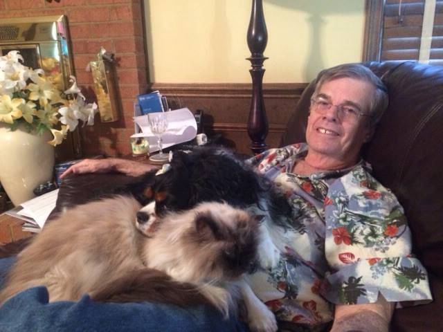 Pastor Bob Lee's dad in his favorite chair with dogs on his lap